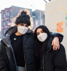 This photo of Sisters Sonia and Sonam Parikh accompanies a guide on how to open a community fridge