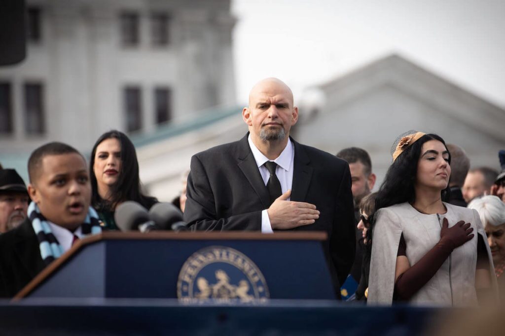 Pennsylvania Lieutenant Governor John Fetterman has his hand on his heart during the National Anthem