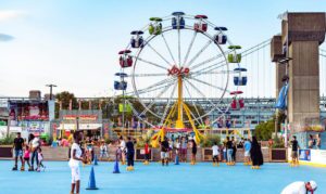 The ferris wheel and other attractions at Blue Cross RiverRink Summerfest