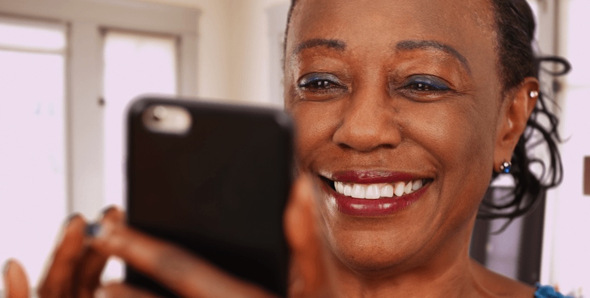 A woman uses her phone to access Philanthropi, an app that connects everyday donors with nonprofits.