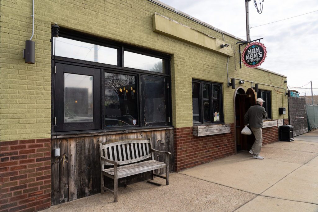A gentleman exits Mom-Mom's Kitchen, a popular spot in Philly for Polish food.