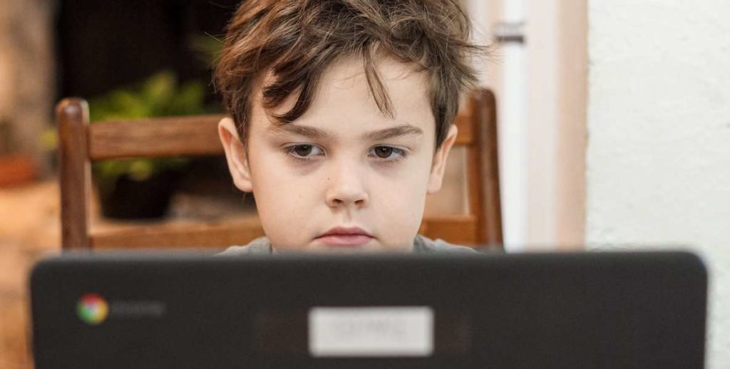 A student does school work at home during the coronavirus quarantine