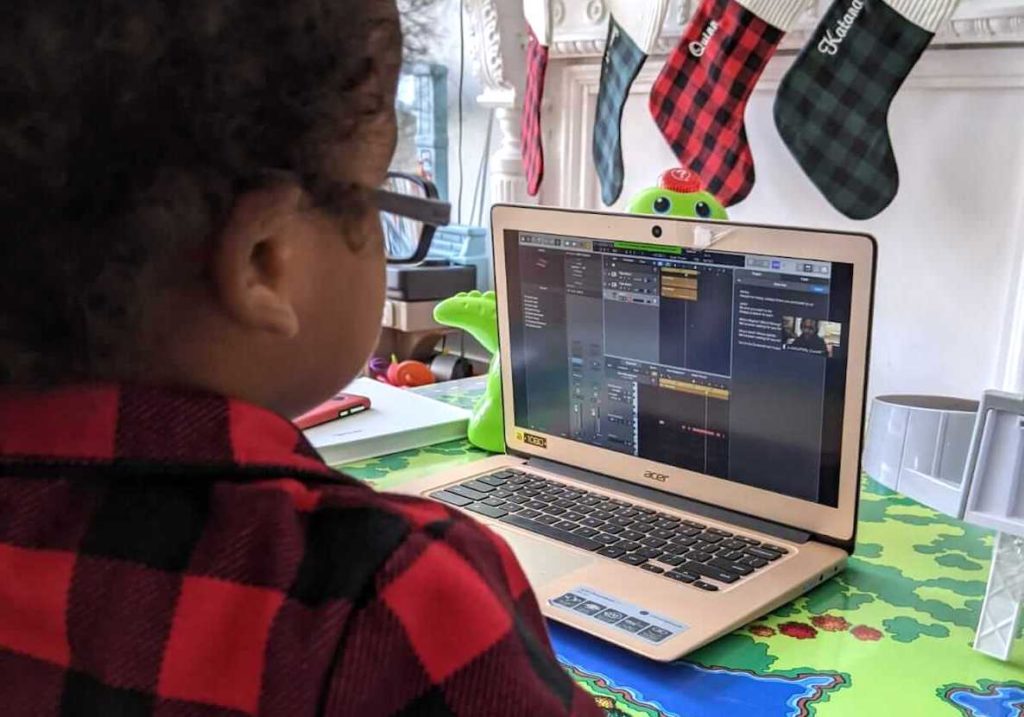 A child involved in Lullaby Project Philadelphia listens to a song its parents created.