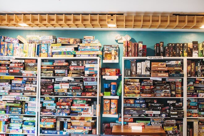 Shelves of board games at the Queen and Rook in Philadelphia.
