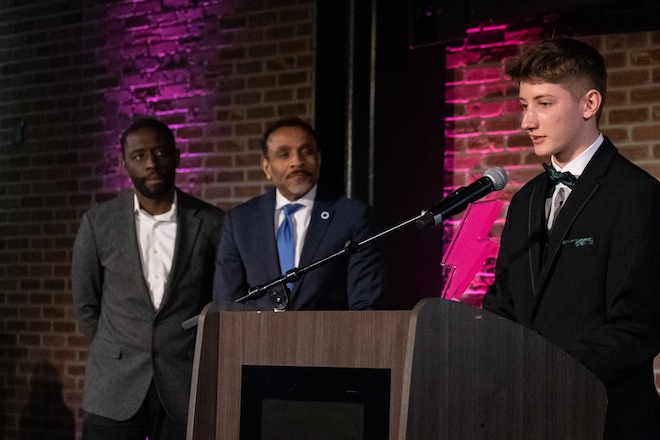 Delcan Cassidy, Youth Citizen of the Year (foreground), with City Council At-Large Member Isaiah Thomas (left) and School District of Philadelphia Superintendent Tony Watlington.