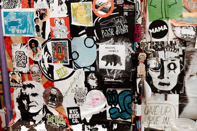 Stickers on a wall at Tattooed Mom.