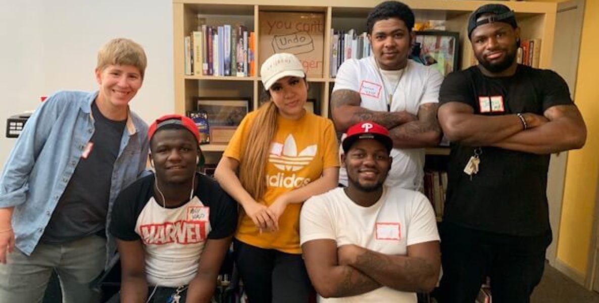 Members of the Youth Art & Self-empowerment Project pose for a group photo.