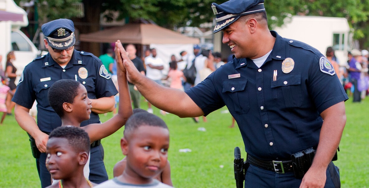 Police officer giving kind high