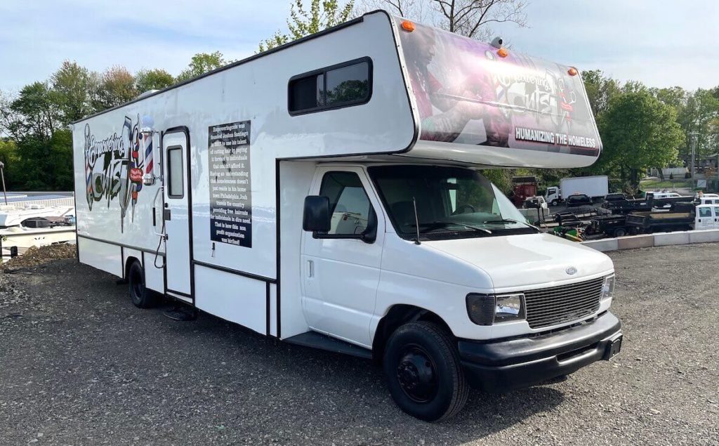 The Empowering Cuts mobile barbershop
