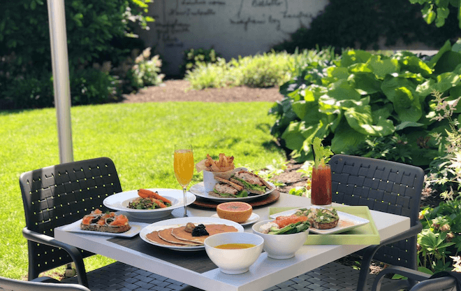 A table is set with drinks and food outside the Barnes Foundation in Philadelphia.