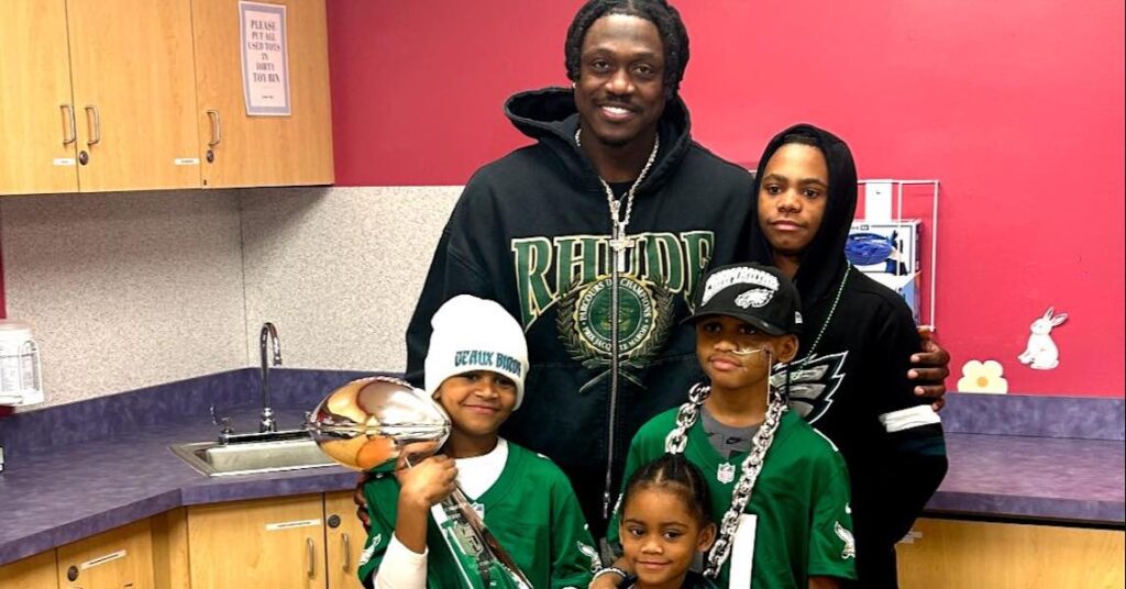 Trey Howard (black cap) and his siblings with A.J. Brown at Children's Hospital of Philadelphia.