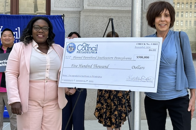 Philadelphia City Councilmember At-Large Kendra Brooks present a check to Planned Parenthood of Southeastern PA President and CEO Dayle Steinberg.