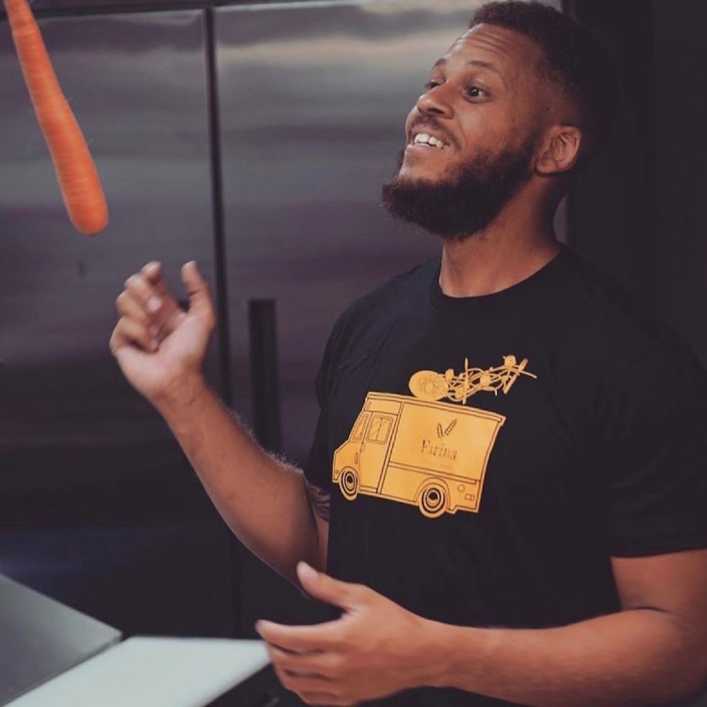 Chef and U.S. Army veteran Daniel Lee tosses a carrot in the air for Farina Pasta and Noodle, his vet-owned restaurant