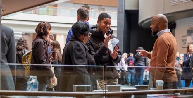 A student approaches a table at the Kimmel Center at Project 440's college fair for musicians who want to go onto college. Project 440 offers a way to help Philly students.