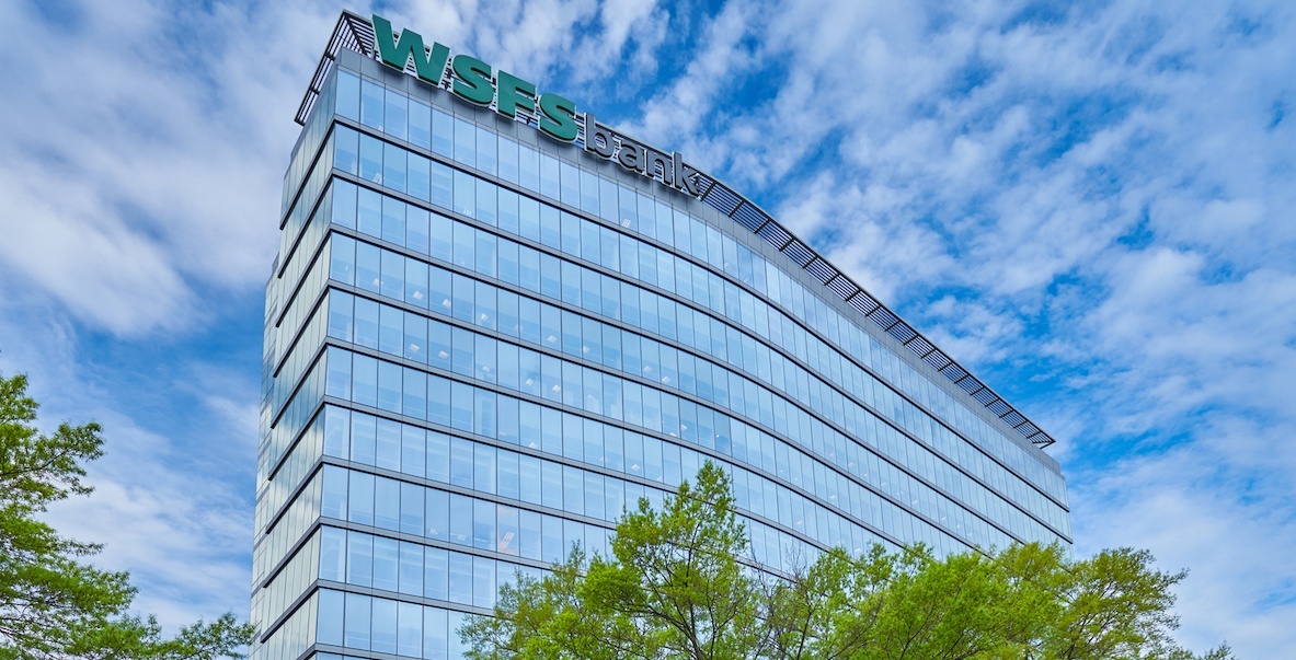 WSFS bank with a sunny, cloud-filled sky as a backdrop.