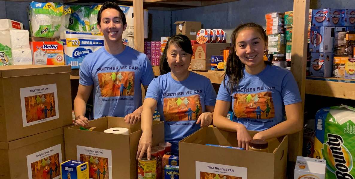 Delco mother Patty Bassett (center) and her children load boxes full of food for families experiencing hunger in Delaware County during the coronavirus pandemic.