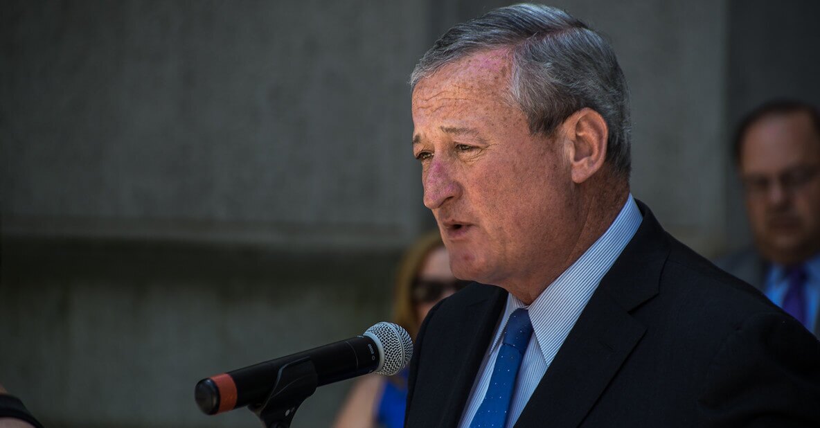 Mayor Jim Kenney speaking in front of microphone