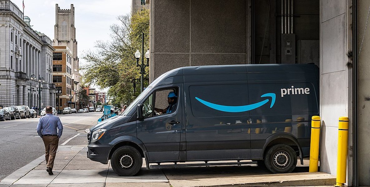Amazon Prime van pulling out of driveway in city