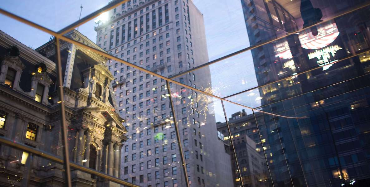 A view of City Hall and surrounding buildings in Philadelphia through a glass commuter tunnel.
