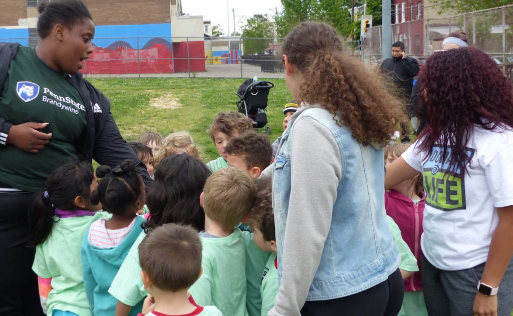 Coach Jakeema Burton rallies young kids at a Kensington Soccer Club event