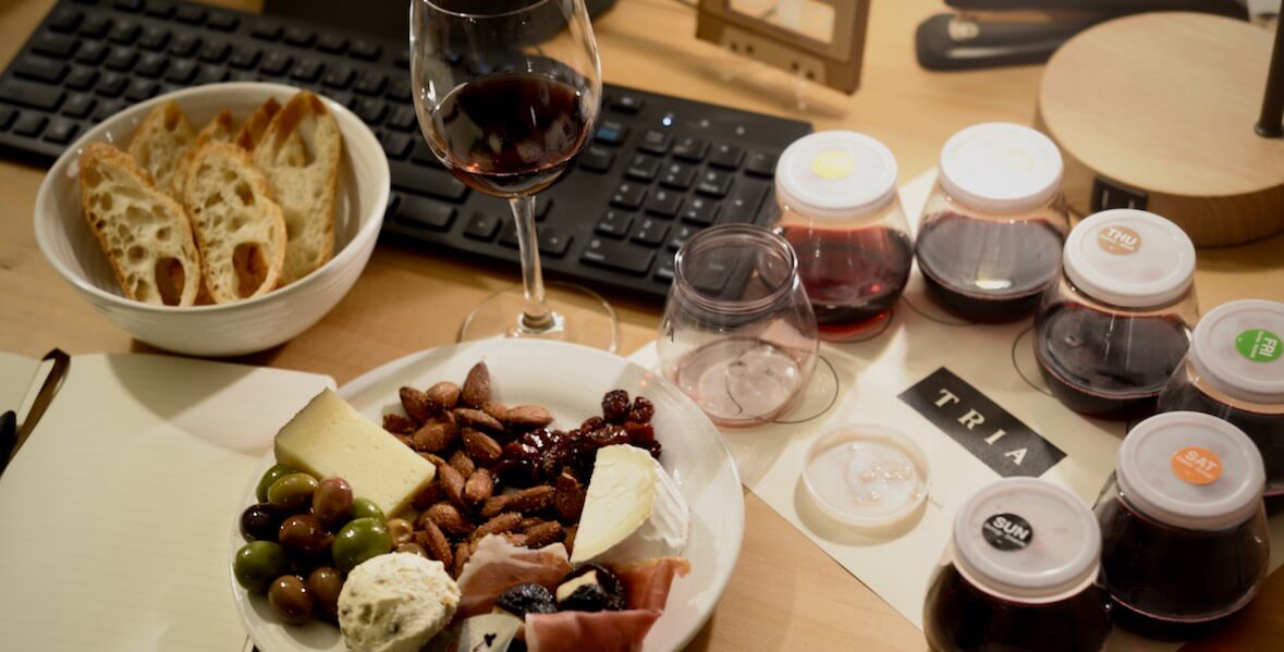 wine samples and cheese board in front of computer for Tria's virtual wine classes