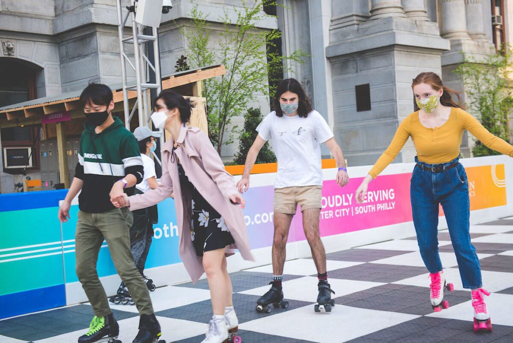 Locals skate at the outdoor roller rink at Philadelphia City Hall