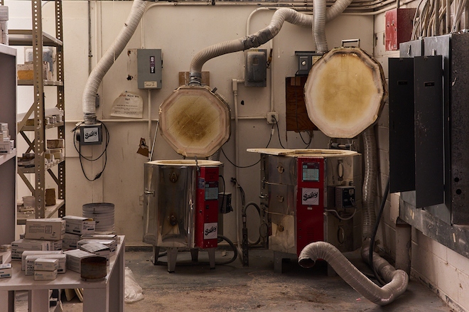 Two kilns stand side by side in an abandoned ceramics shop at the University of the Arts.