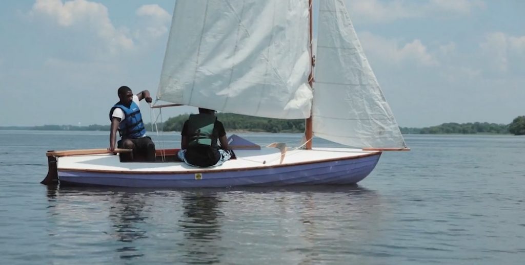Students at the Philadelphia Wooden Boat Factory take their craft out on the water