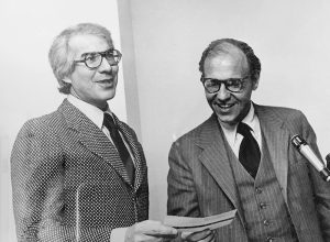 Ed Snider hands a check to Joe Smukler in 1976. Photo courtesy of Connie Smukler