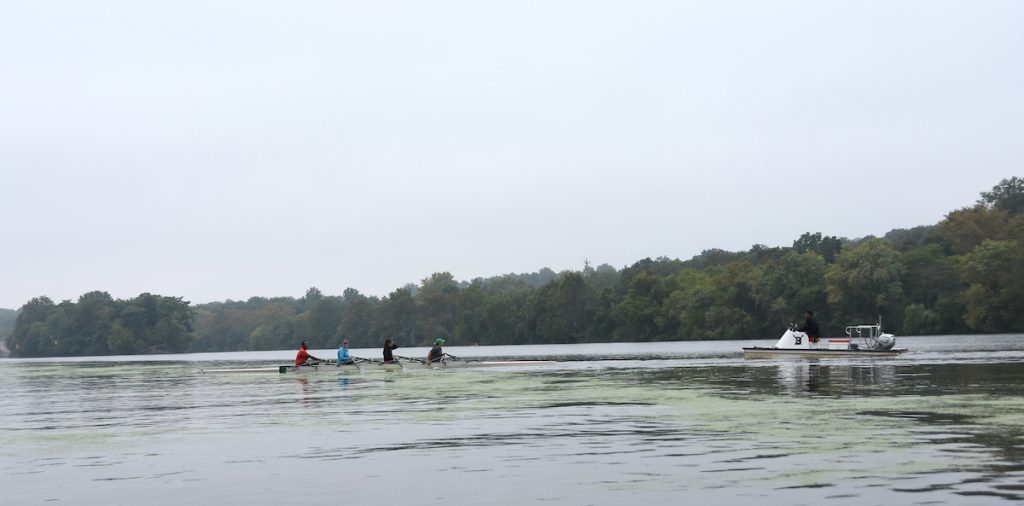 Brannon Johnson coaches a quad of 1st year rowers on the Schuylkill. 