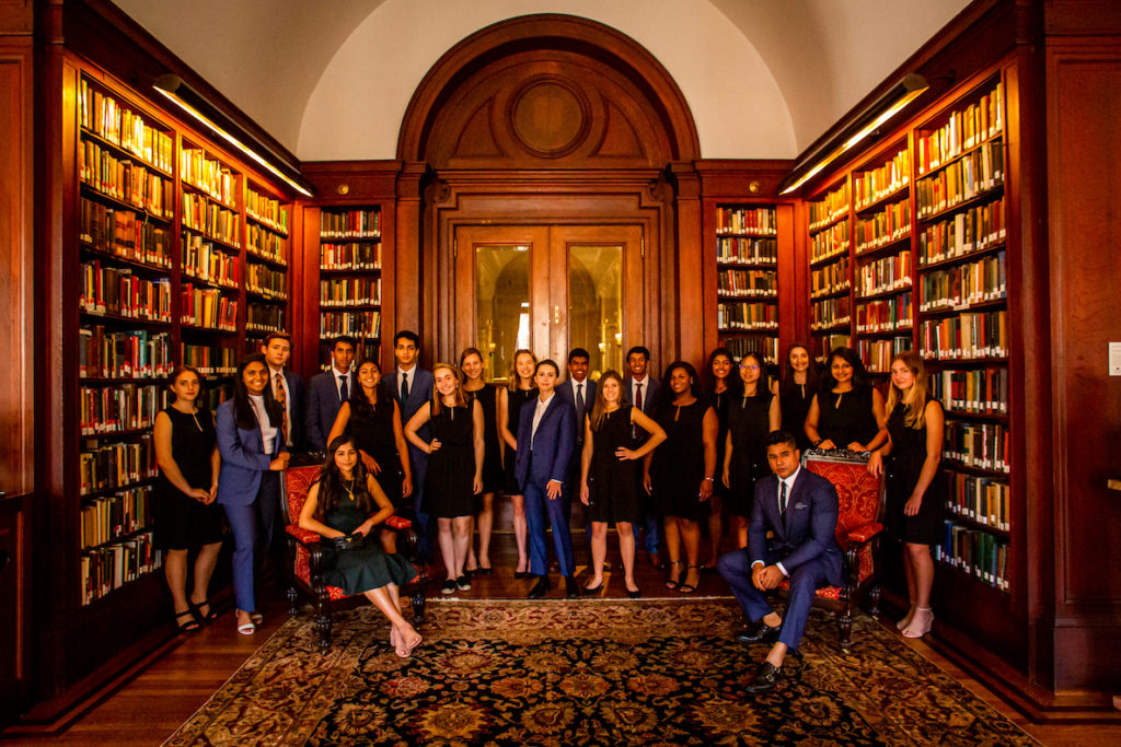 The 2019 Germination Project Fellows pose in a library with founder Ajay Raju