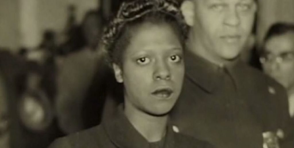 A sullen Corrine Sykes, the first African-American woman executed in Pennsylvania, stares into the camera.