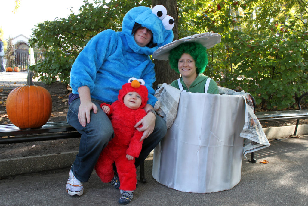 A family dressed as Sesame Street characters Oscar the Grouch, Elmo and Cookie Monster smile for the camera at Philadelphia Zoo's annual Boo at the Zoo Halloween party.