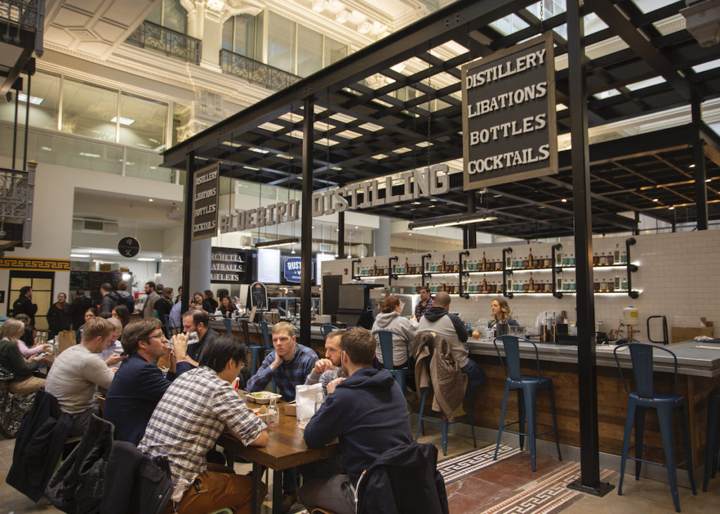 Customers dine at The Philadelphia Bourse, an 1895 commodities exchange that became an artisan food hall in 2018. The historic venue features 30 merchants serving grilled cheeses, pastas, Filipino comfort foods, chaat, Korean tacos, cinnamon buns, pizza, poke, ice cream, craft beer and more.