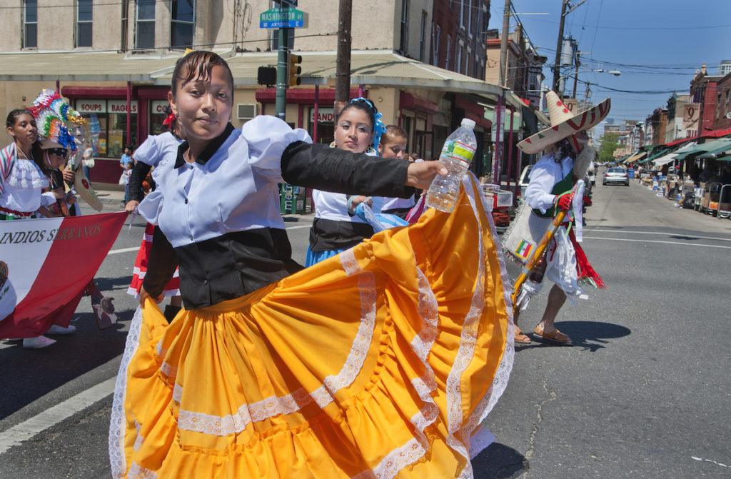 A young Latina woman dances at El Carnaval de Puebla in Philadelphia.