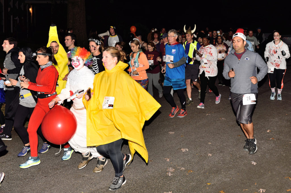 People dressed in all kinds of costumes run through West Laurel Hill Cemetery for the annual Run4URLife charity event.