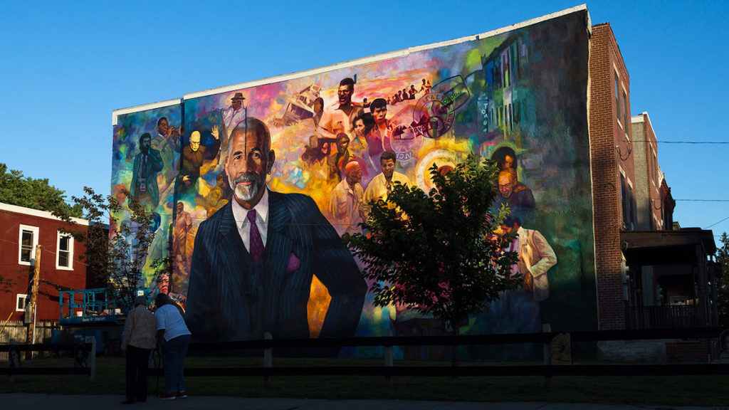 A colorful mural depicting 60 Minutes anchor Ed Bradley decorates a neighborhood in West Philly