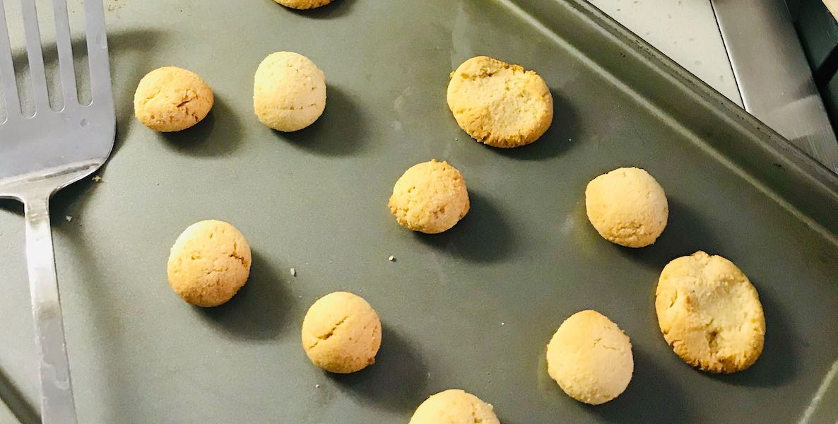 Kwanzaa cookies line a baking sheet, with a spatula to the right