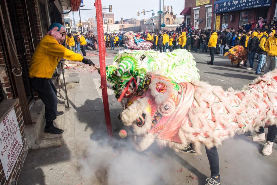 Spectators watch the annual lion dance parade to celebrate Lunar New Year in Chinatown.