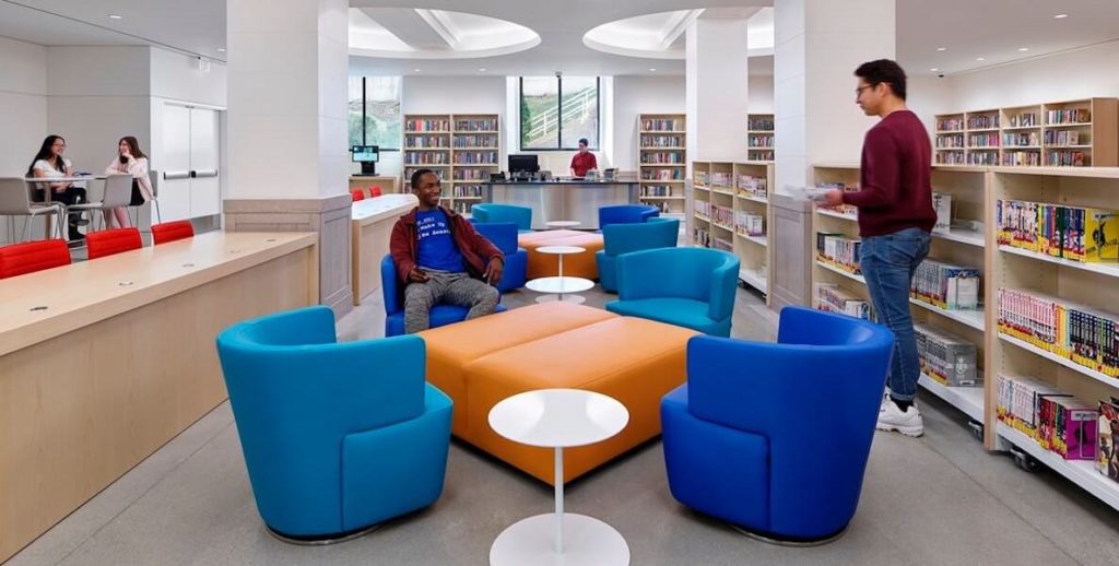 Youth lounge around a brightly lit and colorful Field Teen Center, located in the basement of the Central Parkway Branch of the Free Library of Philadelphia.