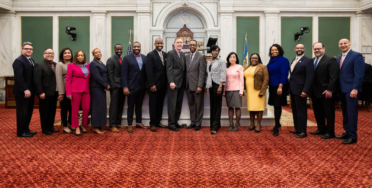 Members of Philadelphia City Council pose for a photo in the chamber at City Hall.