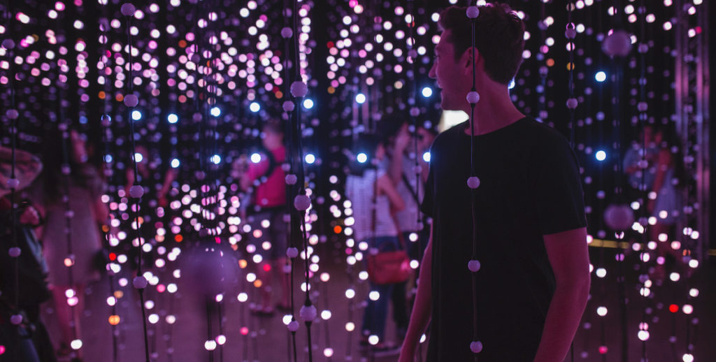 A man explores one of the light exhibitions in Wonderspaces Philadelphia.