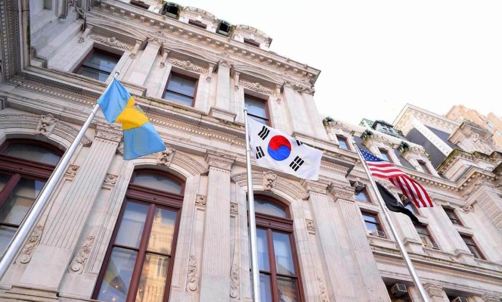 The South Korean flag waves between the U.S. flag and the City of Philadelphia flag at City Hall.