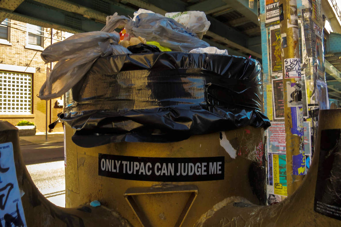 A sticker on a garbage can in Philadelphia reads "only Tupac can judge me."