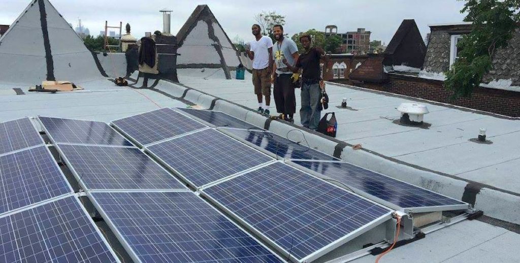 Members of Serenity Soular install solar panels on a home in Philadelphia