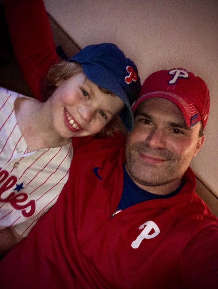 Mike Wang and his son Elliot after a recreated Phillies game in their living room during Covid-19