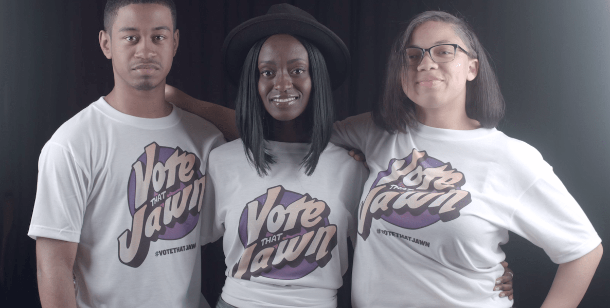 Three members of the #VoteThatJawn team sport T-shirts that read Vote That Jawn.