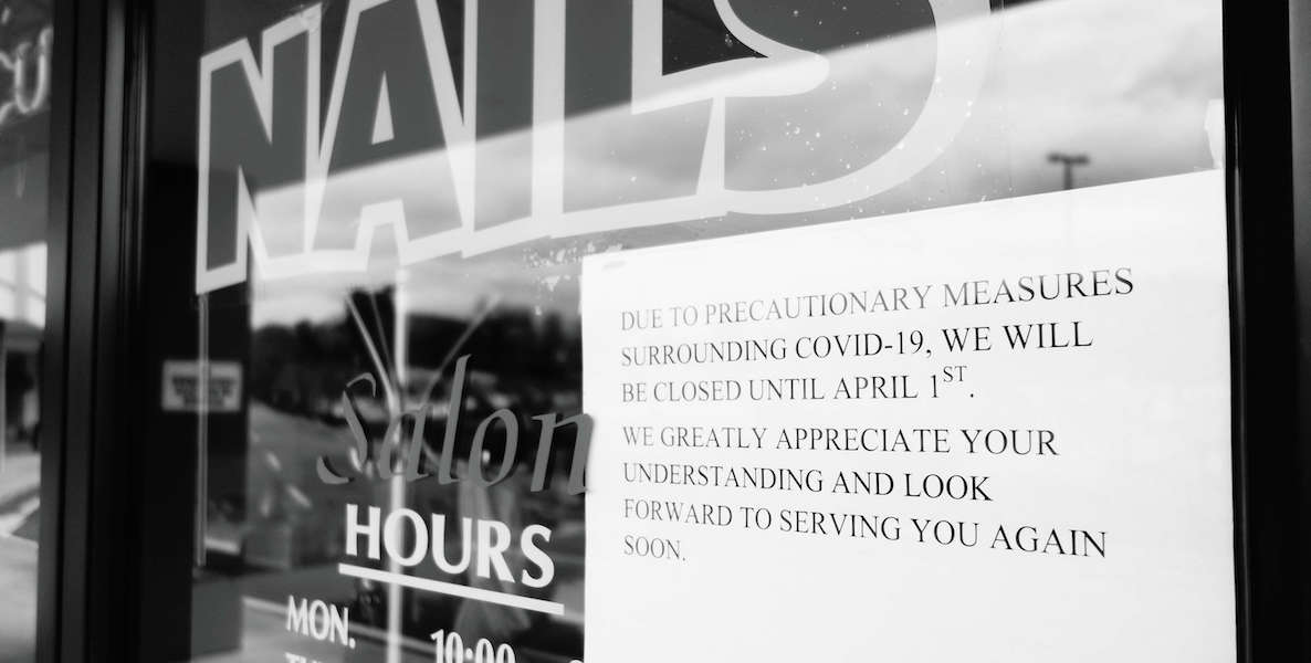 A sign on a nail salon shows that the business is shutdown during the coronavirus epidemic. Will the CARES Act be enough to help them survive?