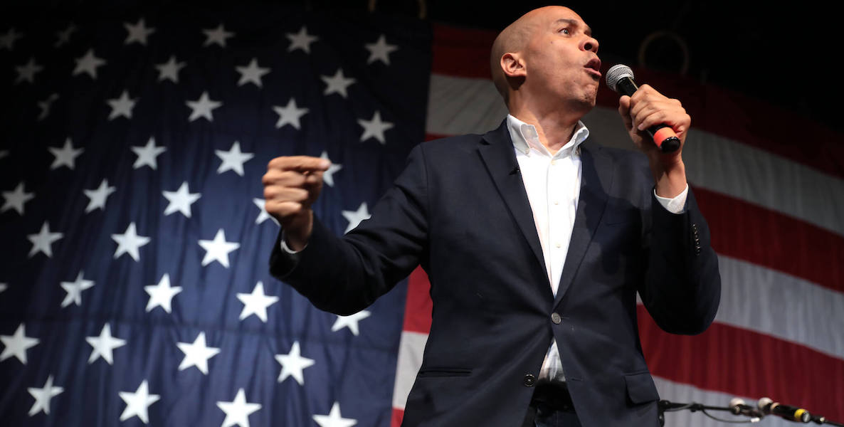 Senator Cory Booker delivers a speech in front of a massive American flag. He's behind the RELIEF for Main Street act, which would provide much-needed assistance for small and minority-owned businesses after the coronavirus pandemic.