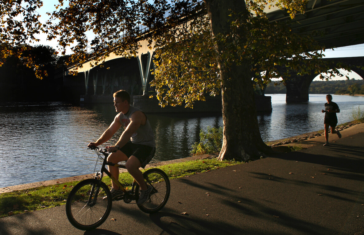A man rides his bike along the Schuylkill Trail near Center City Philadelphia.